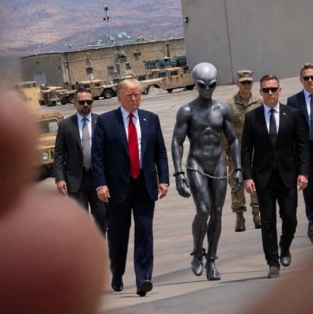 108691287-15828781-The_President_and_bodyguards_flank_the_handcuffed_extra_terrestr-a-2_1779132993145.jpg